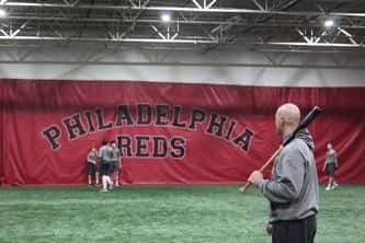Philadelphia Reds teacher practicing with students, baseball training
