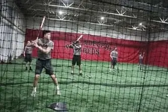 Student in his batting stance at Philadelphia Reds baseball training academy